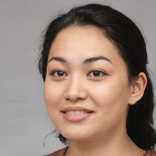 Joyful white young-adult female with medium  black hair and brown eyes