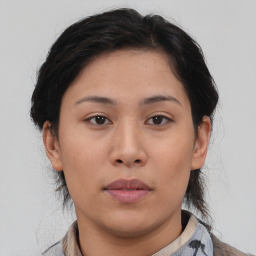 Neutral asian young-adult female with medium  brown hair and brown eyes