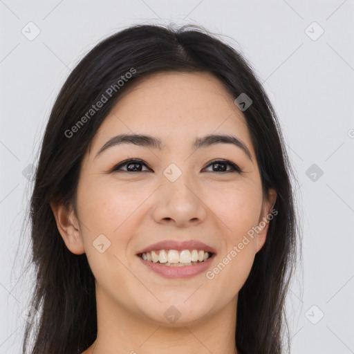 Joyful asian young-adult female with long  brown hair and brown eyes