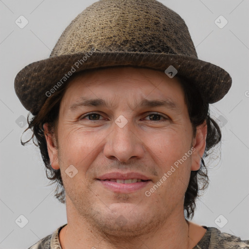 Joyful white adult male with short  brown hair and brown eyes