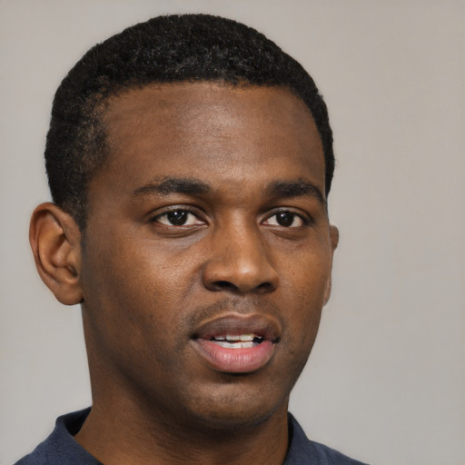 Neutral black young-adult male with short  black hair and brown eyes