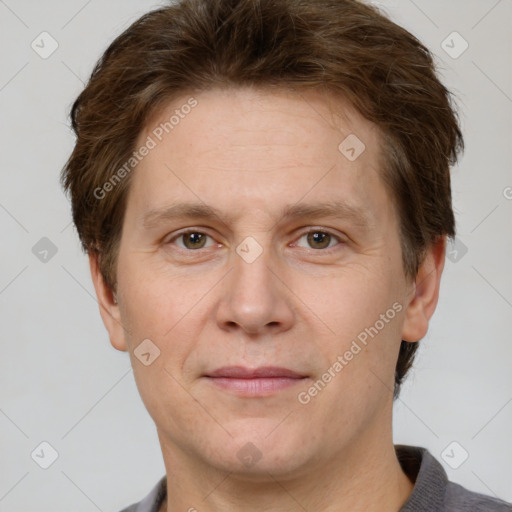 Joyful white adult male with short  brown hair and grey eyes