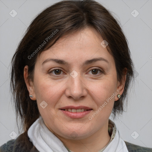 Joyful white adult female with medium  brown hair and brown eyes