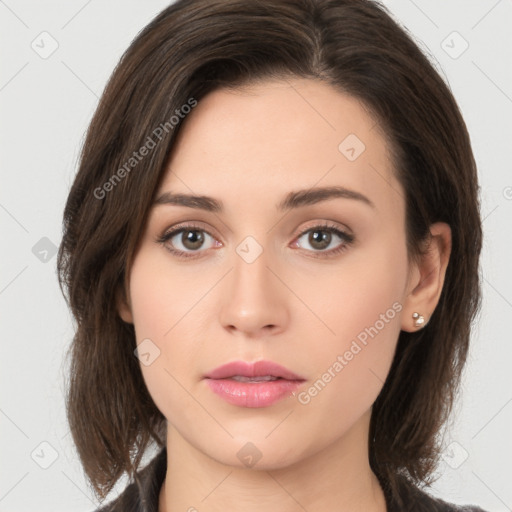 Neutral white young-adult female with medium  brown hair and brown eyes