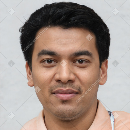 Joyful latino young-adult male with short  black hair and brown eyes