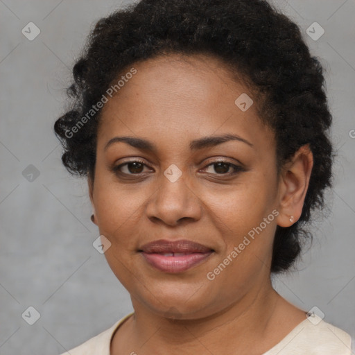 Joyful black adult female with short  brown hair and brown eyes