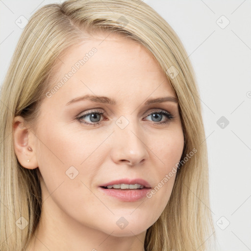 Joyful white young-adult female with long  brown hair and blue eyes