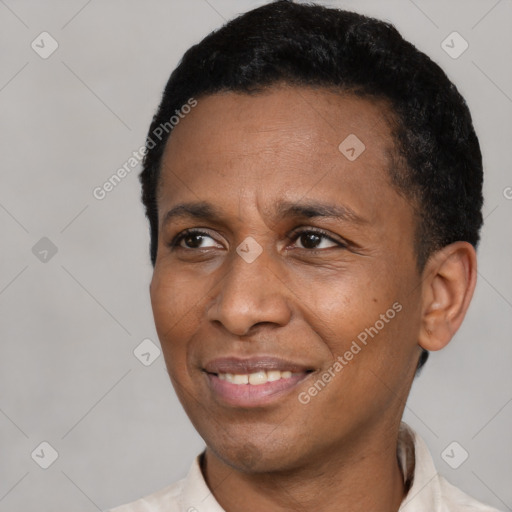 Joyful latino adult male with short  black hair and brown eyes