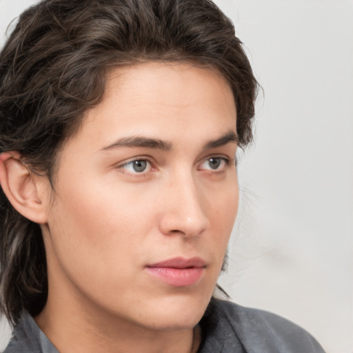 Neutral white young-adult male with medium  brown hair and brown eyes