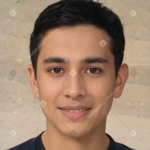 Joyful latino young-adult male with short  brown hair and brown eyes