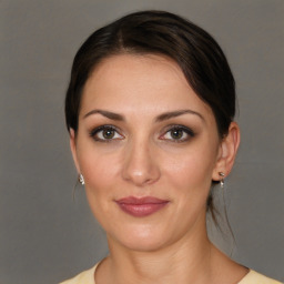 Joyful white young-adult female with medium  brown hair and brown eyes