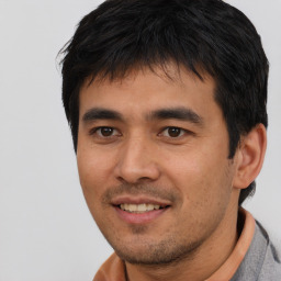 Joyful asian young-adult male with short  black hair and brown eyes