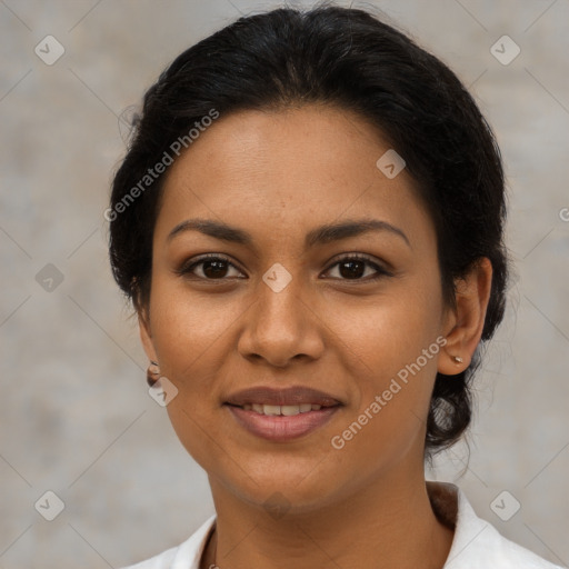 Joyful latino young-adult female with medium  brown hair and brown eyes