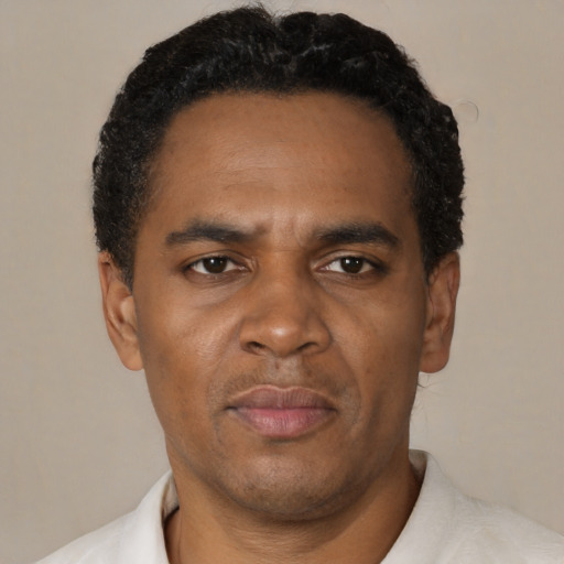 Neutral black adult male with short  black hair and brown eyes