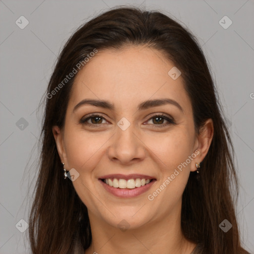 Joyful white young-adult female with long  brown hair and brown eyes