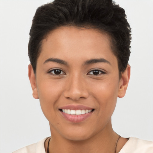 Joyful latino young-adult female with short  brown hair and brown eyes