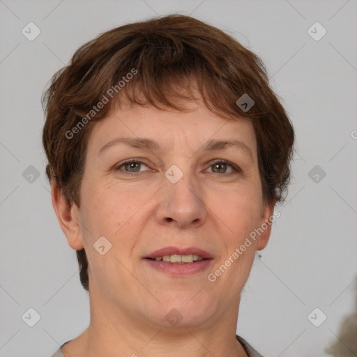 Joyful white adult female with short  brown hair and grey eyes