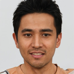 Joyful asian young-adult male with short  black hair and brown eyes