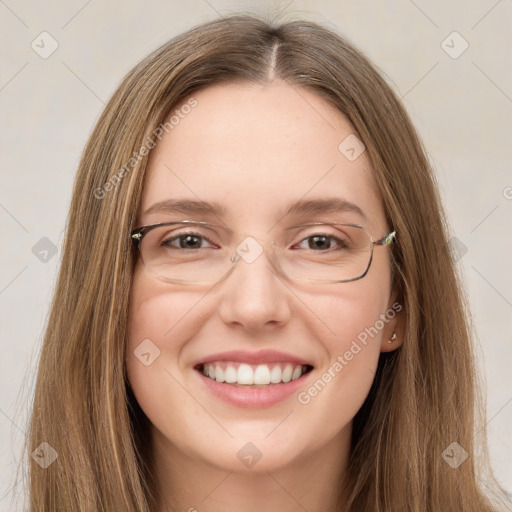 Joyful white young-adult female with long  brown hair and green eyes