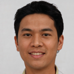 Joyful asian young-adult male with short  black hair and brown eyes