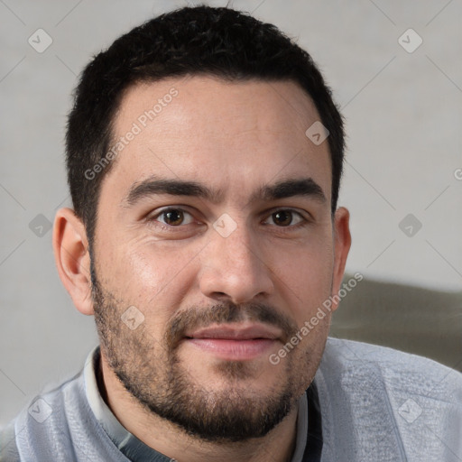 Joyful white young-adult male with short  black hair and brown eyes