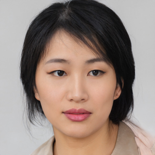 Neutral asian young-adult female with medium  black hair and brown eyes