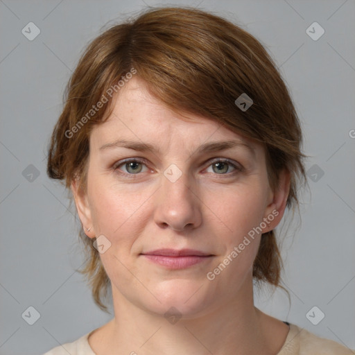 Joyful white young-adult female with medium  brown hair and blue eyes