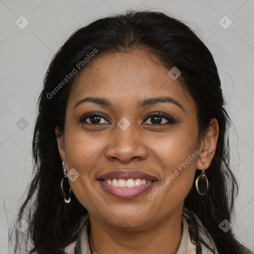 Joyful black young-adult female with long  brown hair and brown eyes