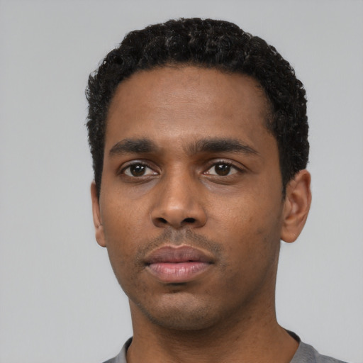 Neutral black young-adult male with short  black hair and brown eyes
