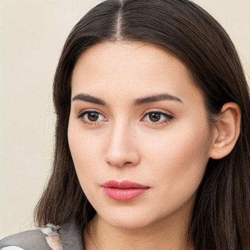 Neutral white young-adult female with long  brown hair and brown eyes