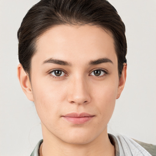 Neutral white young-adult female with short  brown hair and brown eyes