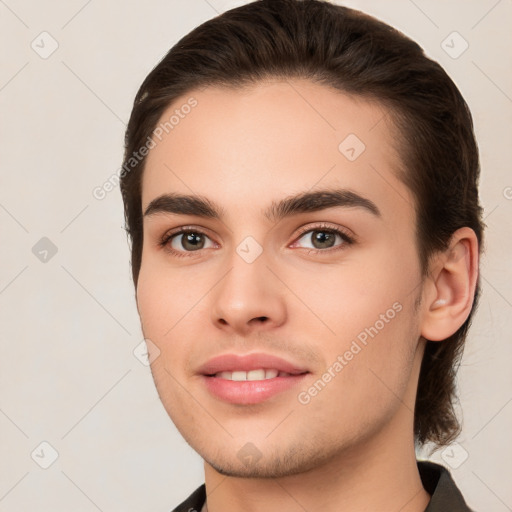 Joyful white young-adult male with medium  brown hair and brown eyes