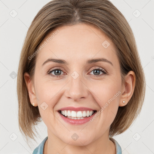 Joyful white young-adult female with medium  brown hair and grey eyes