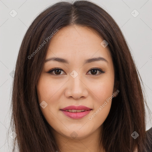 Joyful asian young-adult female with long  brown hair and brown eyes