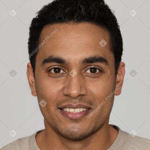 Joyful latino young-adult male with short  black hair and brown eyes