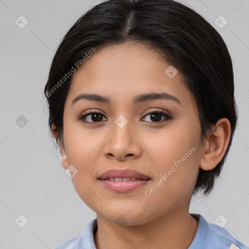 Joyful latino young-adult female with medium  brown hair and brown eyes