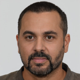 Neutral white adult male with short  black hair and brown eyes