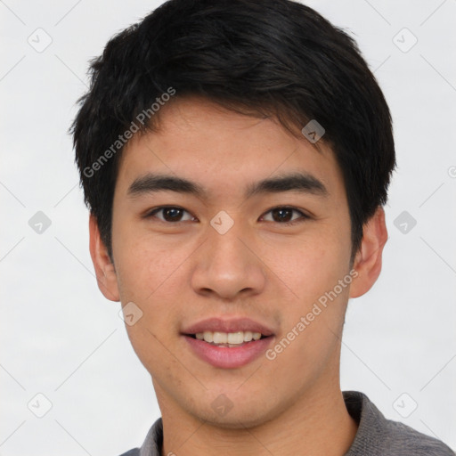 Joyful asian young-adult male with short  black hair and brown eyes