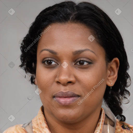 Joyful black adult female with medium  brown hair and brown eyes