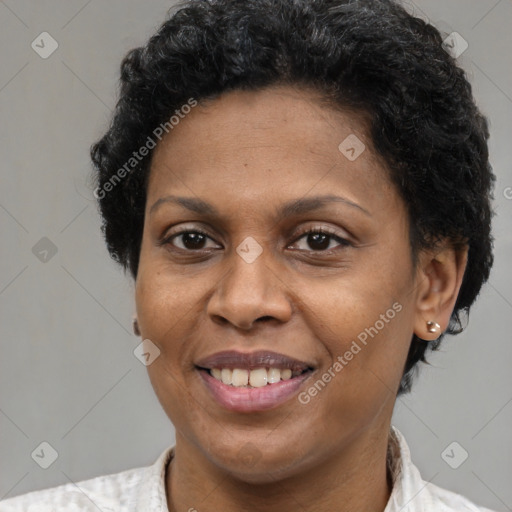 Joyful latino adult female with short  brown hair and brown eyes