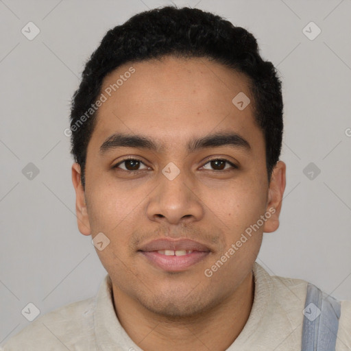 Joyful latino young-adult male with short  black hair and brown eyes