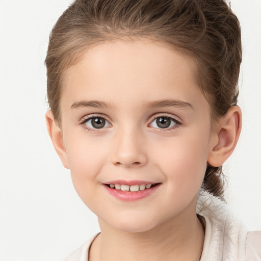 Joyful white child female with medium  brown hair and brown eyes