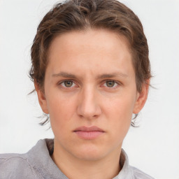 Neutral white young-adult female with short  brown hair and brown eyes