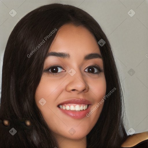 Joyful latino young-adult female with long  black hair and brown eyes