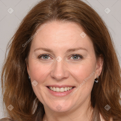 Joyful white adult female with medium  brown hair and grey eyes