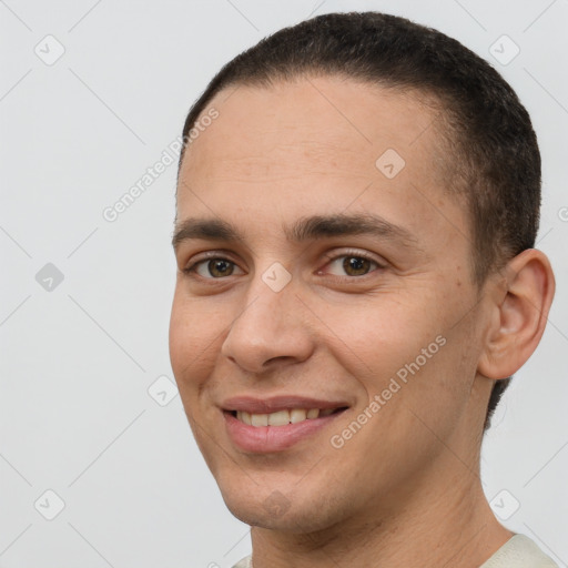 Joyful white young-adult male with short  brown hair and brown eyes