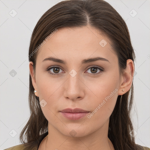 Neutral white young-adult female with long  brown hair and brown eyes