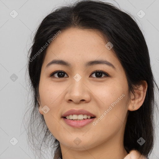 Joyful asian young-adult female with long  brown hair and brown eyes