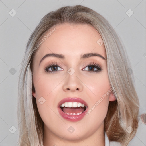 Joyful white young-adult female with long  brown hair and blue eyes