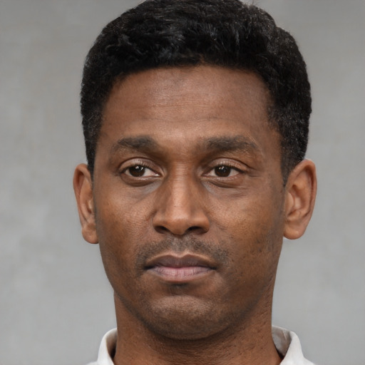 Neutral black young-adult male with short  black hair and brown eyes
